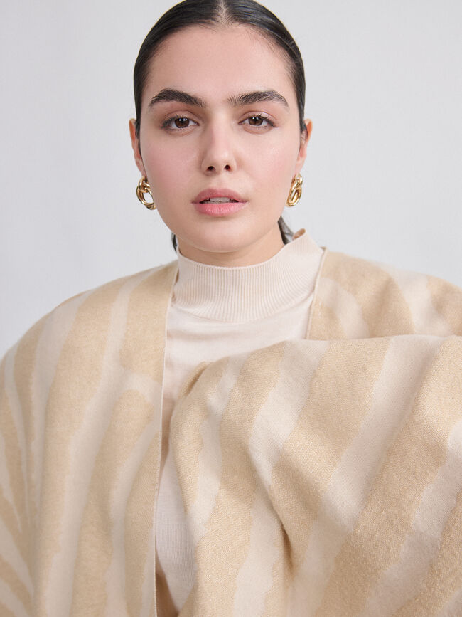 PONCHO ANIMAL PRINT Crudo